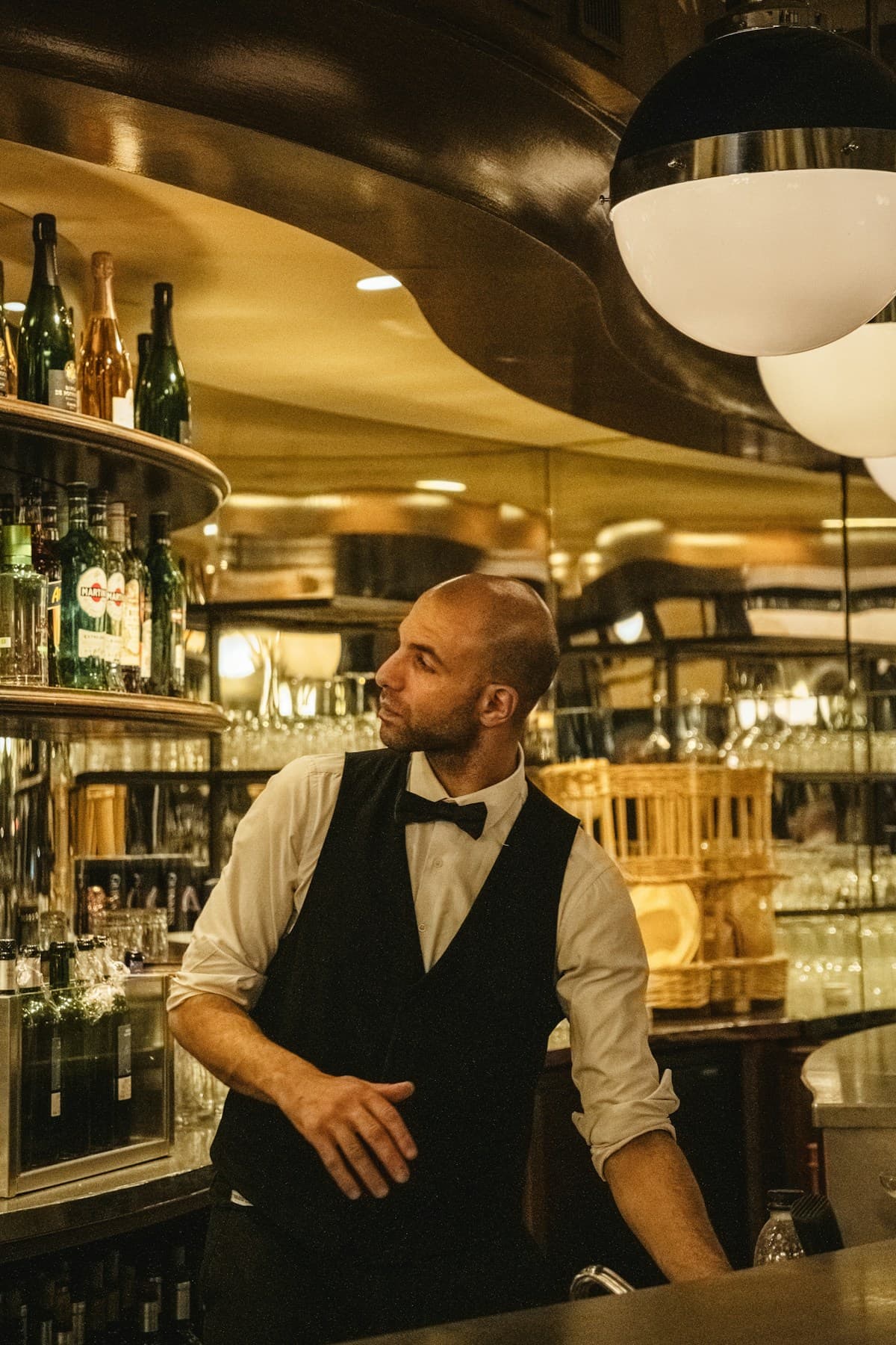 A restaurant team member at work at the bar